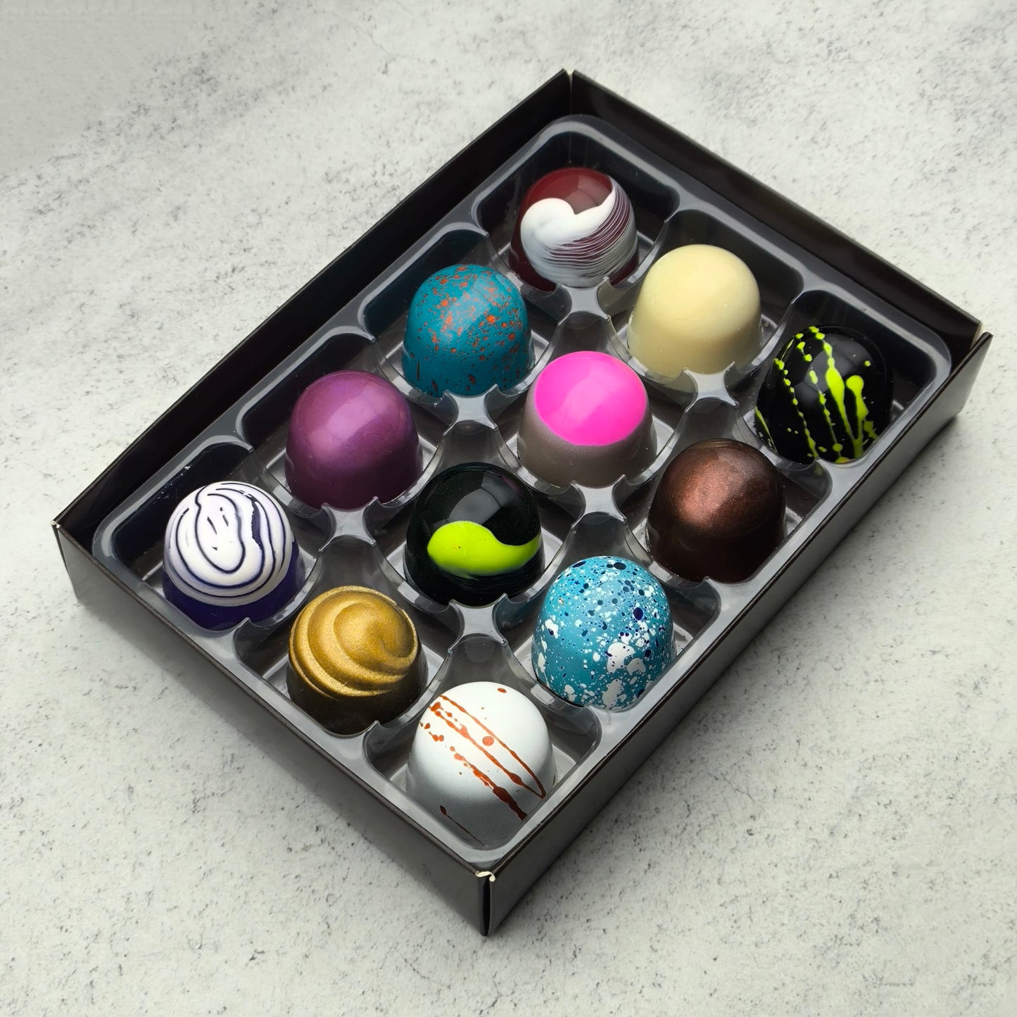 A selection box of 24 artisan chocolate bonbons