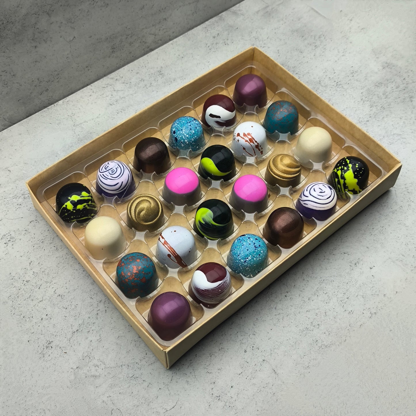 A selection box of 24 artisan chocolate bonbons